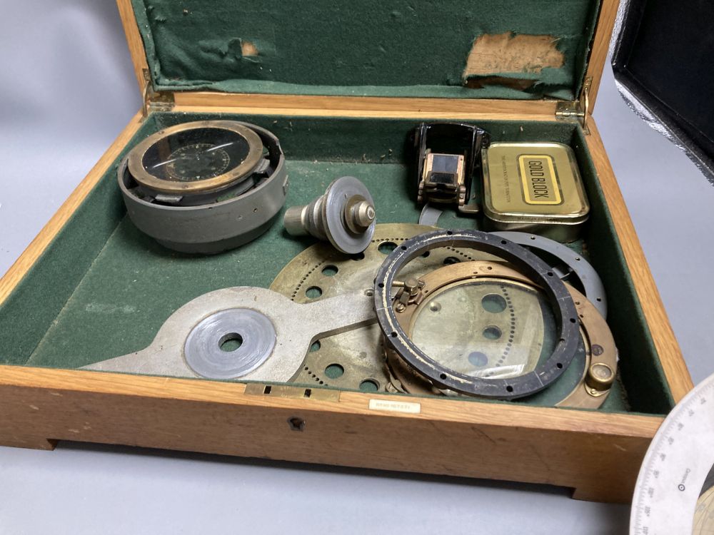 An Air Ministry Astro compass MkII, a similar compass, both cased, a Hydrographic Office Star Identifier and spare Azimuth circle compa